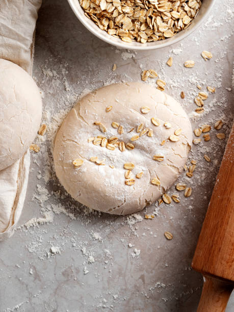oat, fresh raw dough,  oat dough, gluten free, bread or pizza dough, oatmeal - dough sphere kneading bread imagens e fotografias de stock