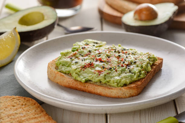 istock Mashed avocado toast with sesame seeds, paprika and sea salt 1300171579