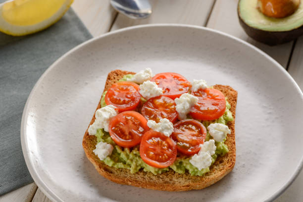 istock Toast with mashed avocado, ricotta and cherry tomato 1300171614