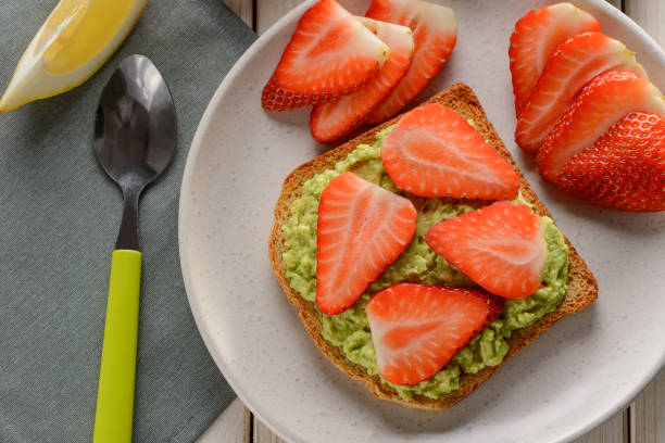 istock Toast with mashed avocado and strawberry slices 1300171730