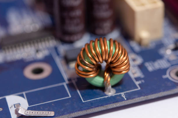 istock Close up Inductor electronic hardware technology on motherboard digital chip 1300171862