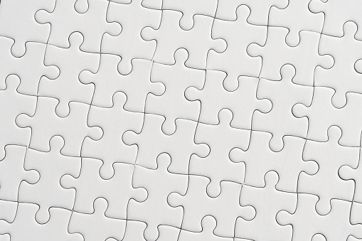 White jigsaw puzzle pattern background.