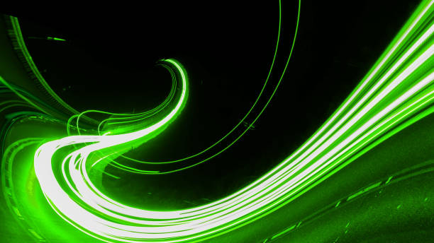 istock green car lights at night. long exposure 1300172223