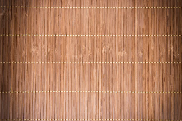 istock Bamboo striped background for design with dark vignette. Wicker bamboo tissue texture with stripes. 1300173255