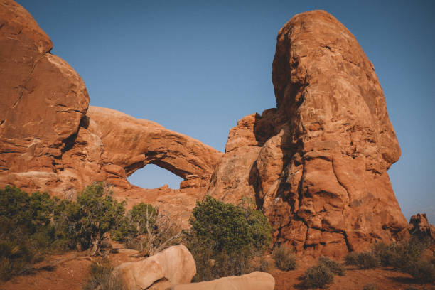 istock Beautiful Red Archway with Juniper and Sandstone 1300173602
