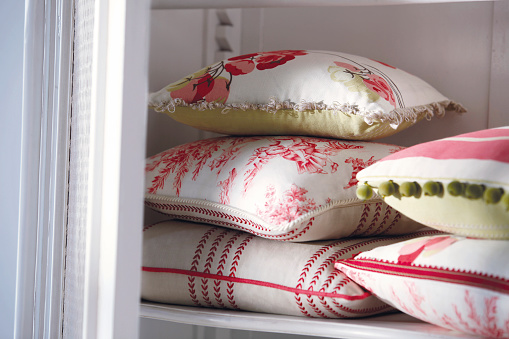 Close-up of multicolored pillows on a shelf