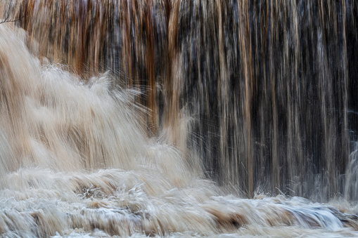 Waterfall, raging water photographed with semi long exposure in pursuit to catch the power of the element water