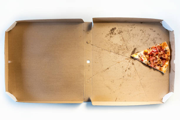 istock Last slice of pizza in a delivery cardboard box 1300176167
