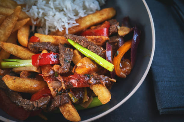 Lomo Salteado Stir Fry Beef with Soy Sauce and Fried Potatoes stock photo