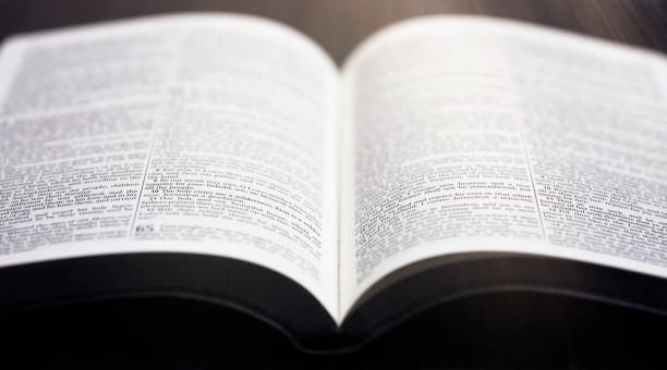 istock Bible Open on a Rustic Wooden Table 1300177942