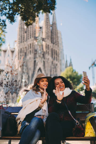 istock Friends in Barcelona talking on video call 1300178322
