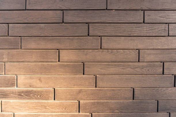 Building cladding with a ventilated facade, wooden texture, gray wood pattern. High quality photo