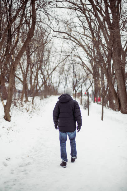 istock A man taking a walk  in the winter 1300180826