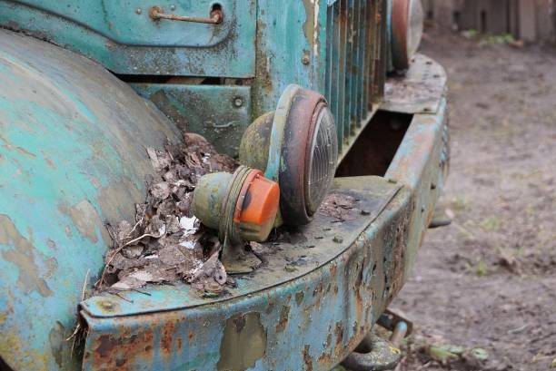 istock two old front round headlights on green rusty iron of a truck 1300180837