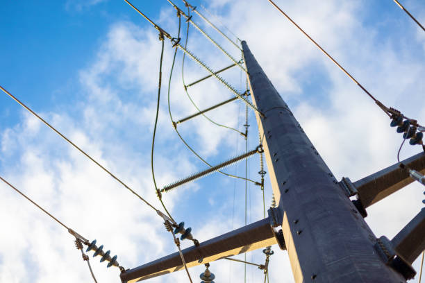Power Grid High Voltage Energy Conduit In Western Colorado Power Poles and Power Lines Part of a Series (Shot with Canon 5DS 50.6mp photos professionally retouched - Lightroom / Photoshop - original size 5792 x 8688 downsampled as needed for clarity and select focus used for dramatic effect)