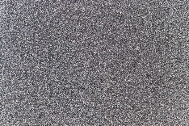 istock Ice crystals on a  black garden table in winter. 1300183870