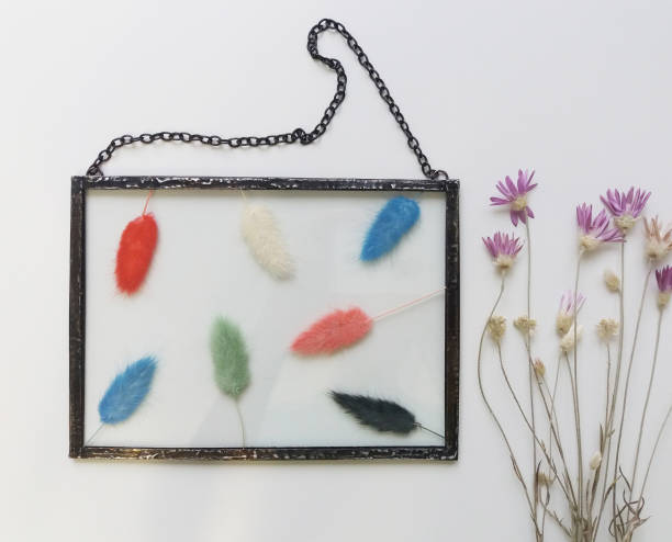 istock Framed pressed flowers in tiffany technique in stained glass 1300183876