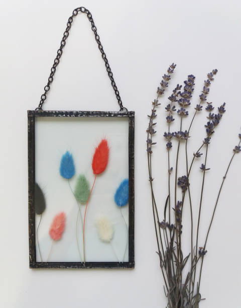 istock Framed pressed flowers in tiffany technique in stained glass 1300183890
