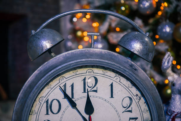 istock Alarm clock and christmas lights 1300184959