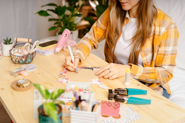istock Making of handmade card from paper. DIY, hobby concept, gift idea, decor with 1300184961