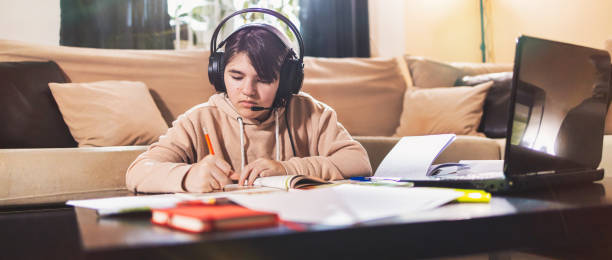 istock Little girl attending to online school class 1300185029