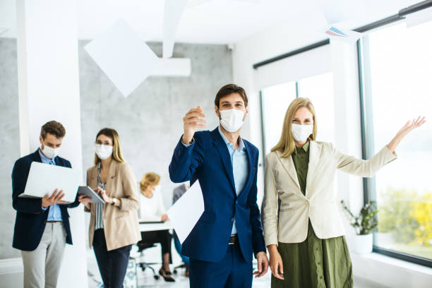 istock Business people dealing with paperwork inside modern office 1300186781