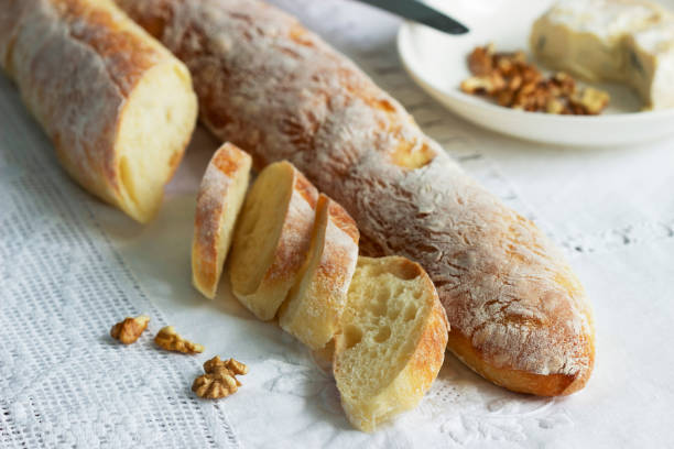 istock Homemade baguettes, served with blue cheese and nuts. Rustic style. 1300188094