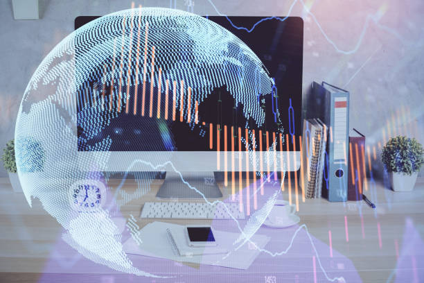 istock Forex graph hologram on table with computer background. Double exposure. Concept of financial markets. 1300192057