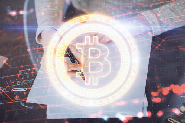 istock Cryptocurrency hologram over woman's hands writing background. Concept of blockchain. Multi exposure 1300193099