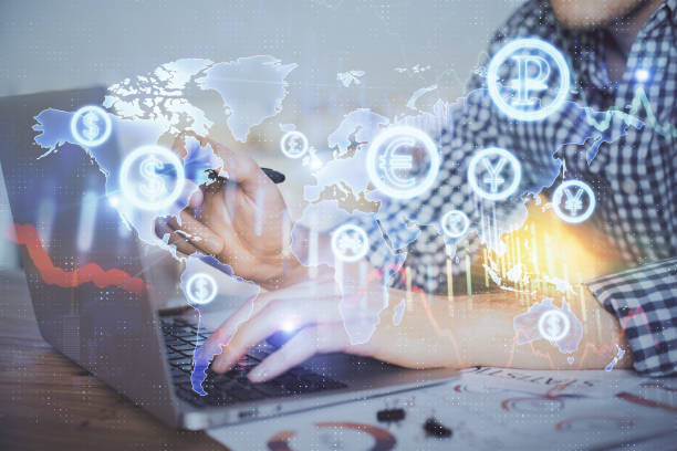 istock Multi exposure of forex graph with man working on computer on background. Concept of market analysis. 1300193244