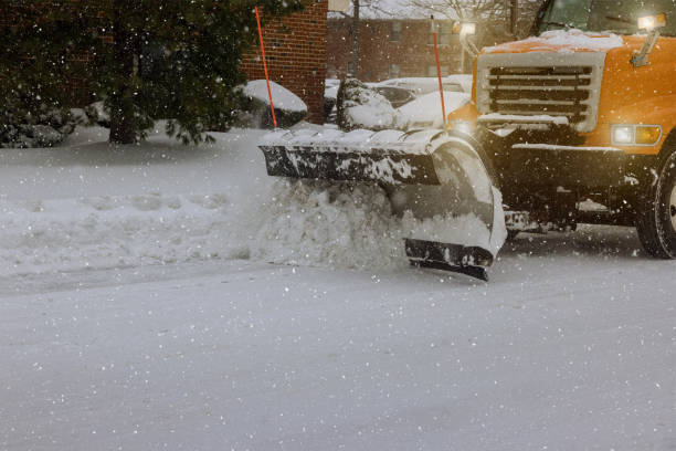 Snow removal after snowfall blizzards Tractor clears snow removal after snowfall blizzards clearing snow plow stock pictures, royalty-free photos & images