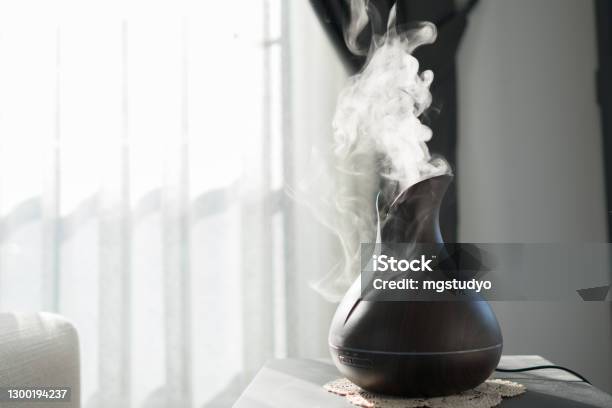 Aroma Oil Diffuser Lamp On The Table Stock Photo - Download Image Now - Aromatherapy Diffuser, Scented, Perfume