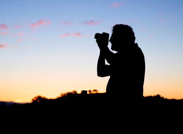 istock Silhouette of a Photographer 1300195263