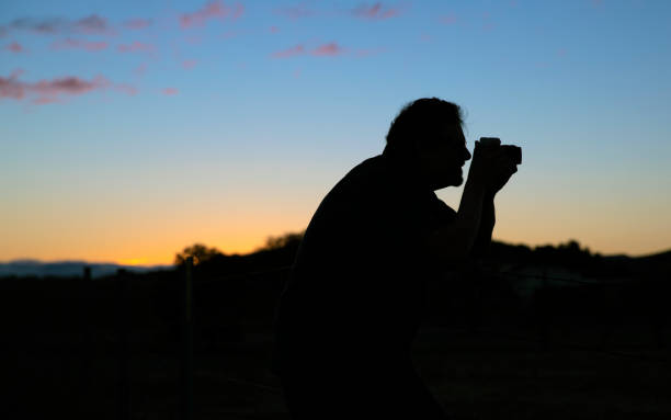 istock Silhouette of a Photographer 1300195283