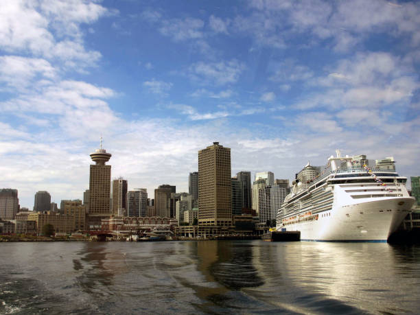 Vancouver, BC, Canada - August 2012: City skyline from a departing ferry boat showing the cruise terminal and buildings