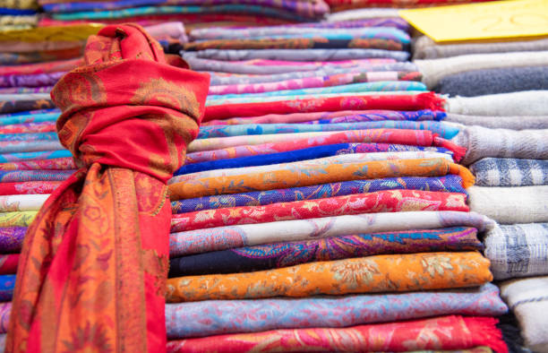 istock Group of multicolored textile for sale close up 1300197556