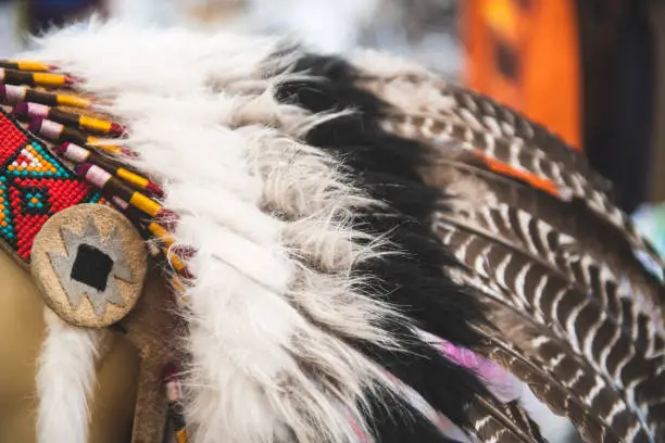 Detail of traditional ceremonial native American feathered headwear called war bonnet