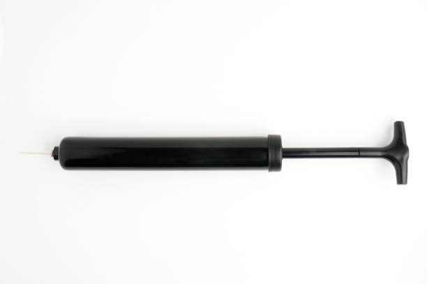 istock Pump and needle for pumping air on a white background 1300198769