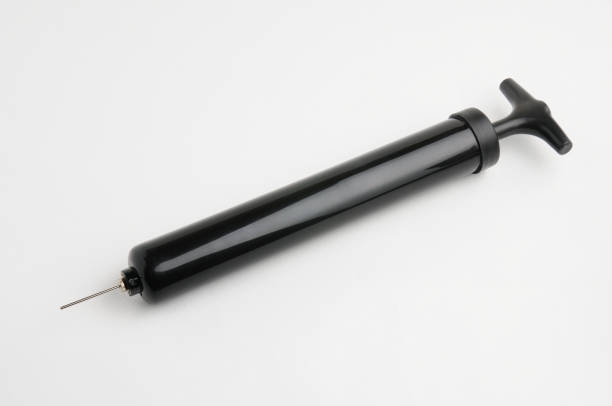 istock Pump and needle for pumping air on a white background 1300198779