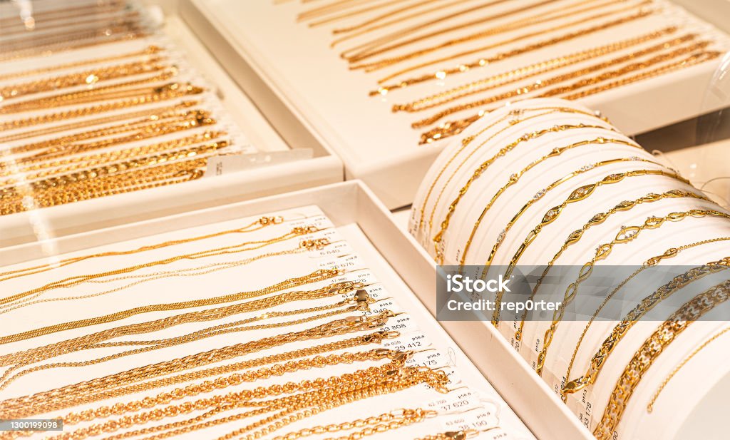 gold chains and bracelets on jewelry display Jewelry Stock Photo