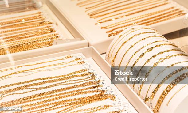 Gold Chains And Bracelets On Jewelry Display Stock Photo - Download Image Now - Jewelry, Jewelry Store, Gold - Metal