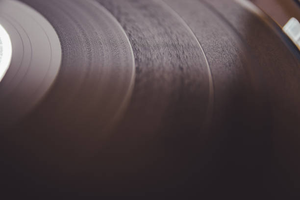 istock Black vinyl record close up. Old school record player .retro record vinyl player 1300200171