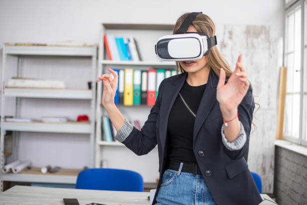 istock Woman Working In Office With VR Headset 1300202751