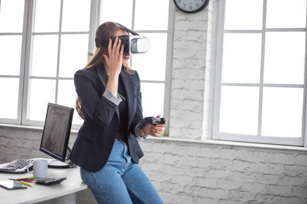 istock Woman Working In Office With VR Headset 1300202759