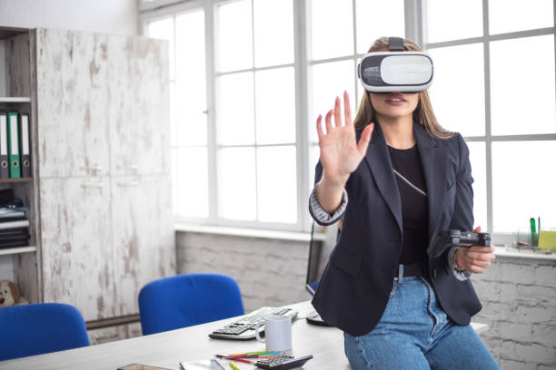 istock Woman Working In Office With VR Headset 1300202762