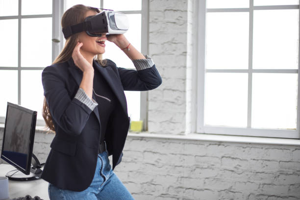 istock Woman Working In Office With VR Headset 1300202780