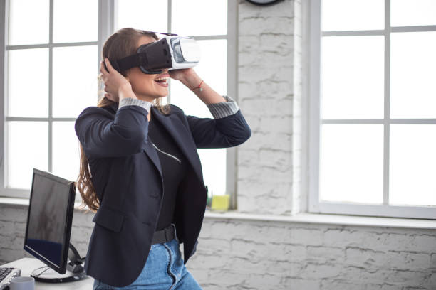 istock Woman Working In Office With VR Headset 1300202790