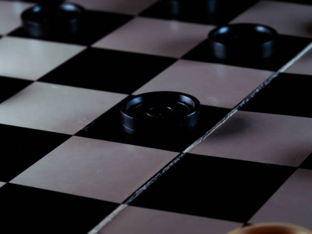 istock checkerboard with checkers. Game concept. Board game. Hobby. checkers on the playing field for a game. 1300206580