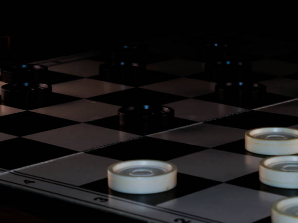 istock checkerboard with checkers. Game concept. Board game. Hobby. checkers on the playing field for a game. 1300206591