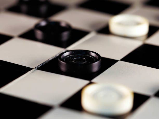 istock checkerboard with checkers. Game concept. Board game. Hobby. checkers on the playing field for a game. 1300206620